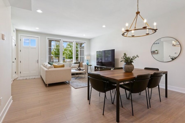 929 Harbor Dr E # 27, Saint Joseph, MI 49085 - dining room with light wood-style floors, a chandelier, and recessed lighting