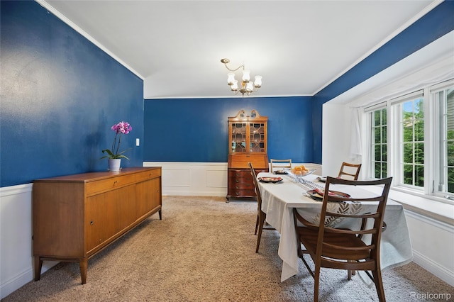 1614 Colorado St, Marysville, MI 48040 - dining space featuring light colored carpet, crown molding, a chandelier, a wainscoted wall, and a decorative wall