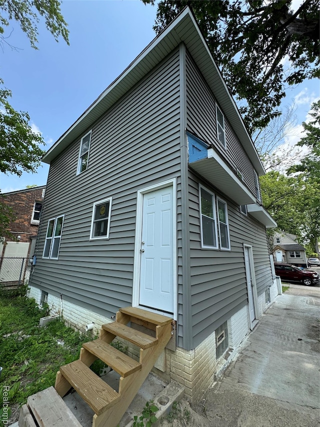 4707 Buckingham Ave, Detroit, MI 48224 - rear view of property with entry steps
