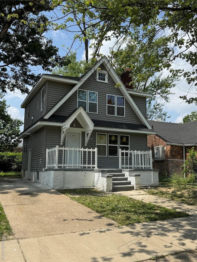 4707 Buckingham Ave, Detroit, MI 48224 - view of front of home featuring a porch, a chimney, and driveway