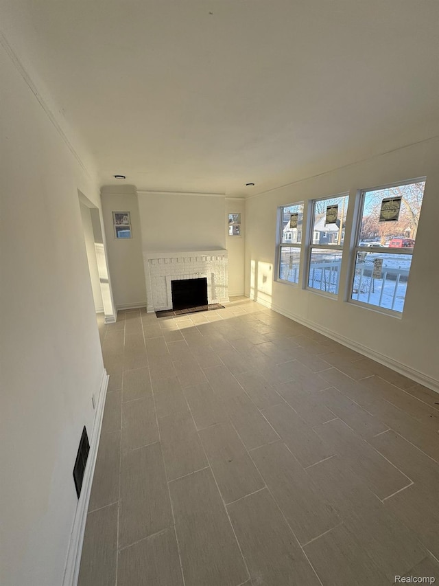 4707 Buckingham Ave, Detroit, MI 48224 - unfurnished living room featuring a fireplace and baseboards
