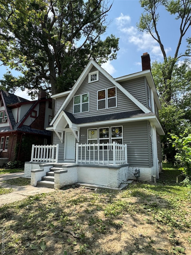 4707 Buckingham Ave, Detroit, MI 48224 - view of front of home featuring a porch and a chimney