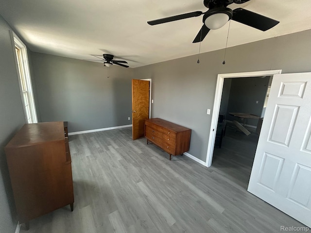 910 Monroe St, Carleton, MI 48117 - unfurnished bedroom featuring wood finished floors and ceiling fan