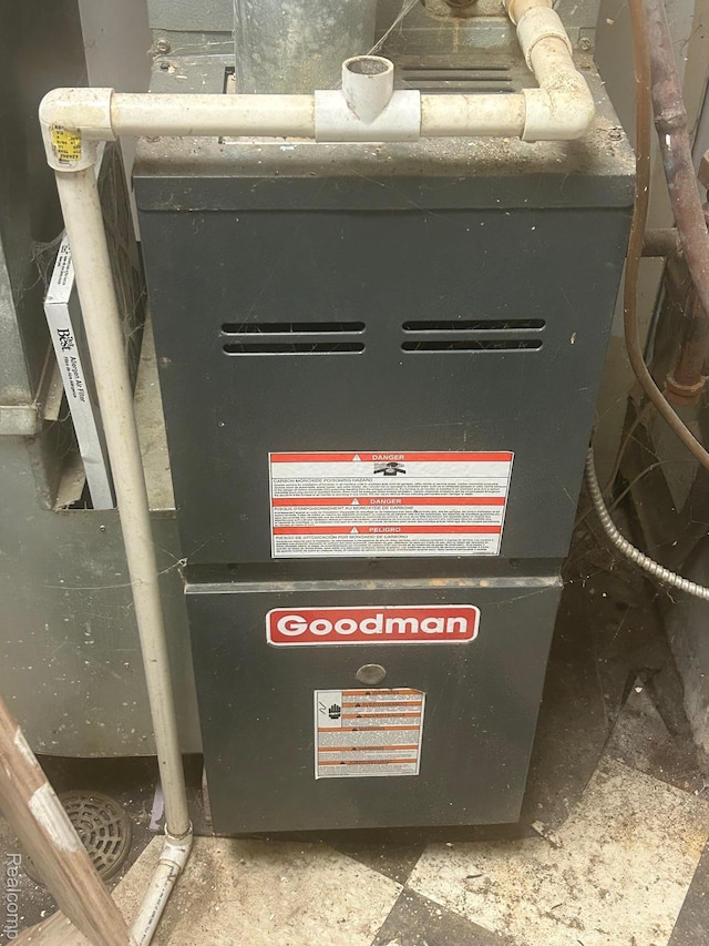 910 Monroe St, Carleton, MI 48117 - utility room with heating unit
