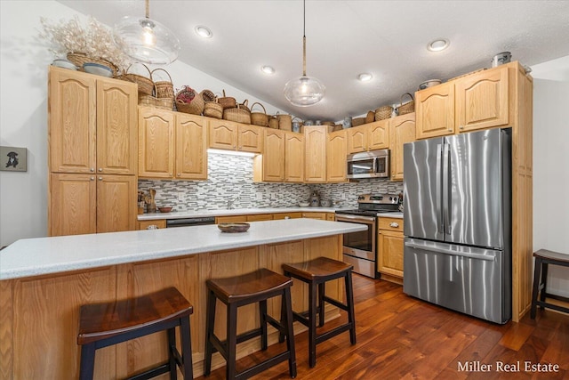 610 Riverwalk St Unit 18, Hastings, MI 49058 - kitchen with appliances with stainless steel finishes, light countertops, backsplash, dark wood-style floors, and lofted ceiling