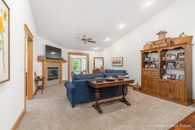 610 Riverwalk St Unit 18, Hastings, MI 49058 - living area with lofted ceiling, a ceiling fan, a tiled fireplace, recessed lighting, and light carpet