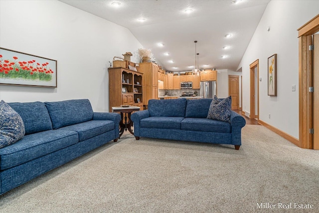 610 Riverwalk St Unit 18, Hastings, MI 49058 - living area with light colored carpet, high vaulted ceiling, and recessed lighting