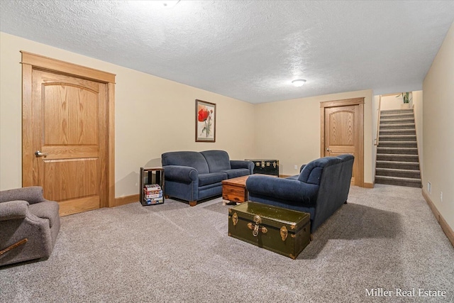 610 Riverwalk St Unit 18, Hastings, MI 49058 - living area featuring carpet, stairs, and a textured ceiling