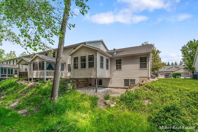 610 Riverwalk St Unit 18, Hastings, MI 49058 - back of property with a sunroom