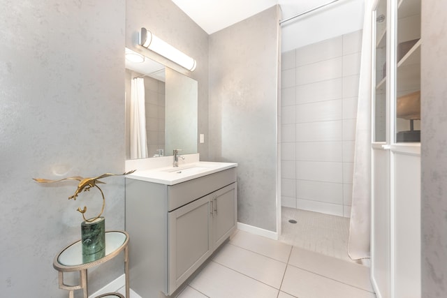 293 N 2nd St Unit 201, Brighton, MI 48116 - bathroom featuring a tile shower, vanity, and tile patterned floors