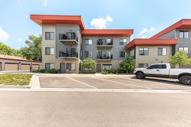 293 N 2nd St Unit 201, Brighton, MI 48116 - view of building exterior featuring uncovered parking