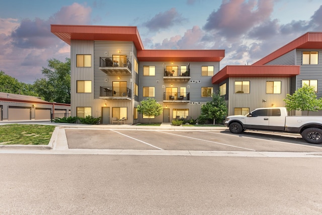 293 N 2nd St Unit 201, Brighton, MI 48116 - property at dusk with uncovered parking
