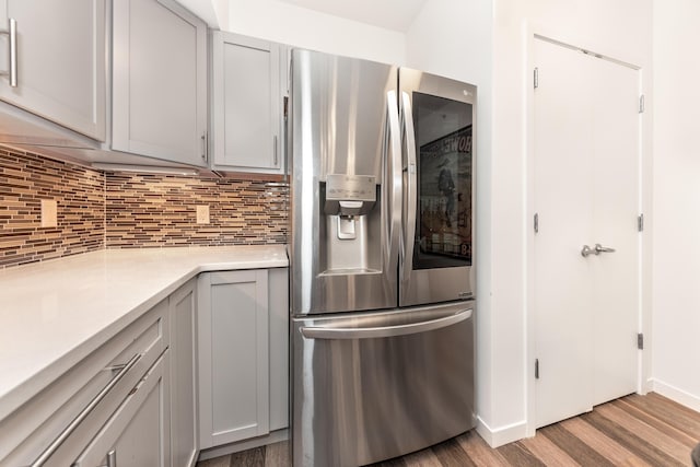 293 N 2nd St Unit 201, Brighton, MI 48116 - kitchen featuring stainless steel fridge with ice dispenser, tasteful backsplash, light wood-style flooring, light countertops, and gray cabinets