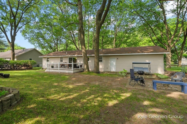 69 Cheyenne Ave, Holland, MI 49424 - back of house featuring a deck and a lawn