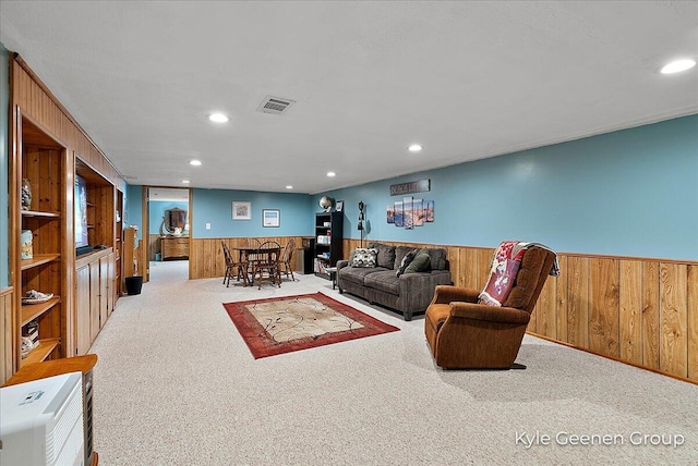 69 Cheyenne Ave, Holland, MI 49424 - living area with wood walls, wainscoting, carpet flooring, and recessed lighting