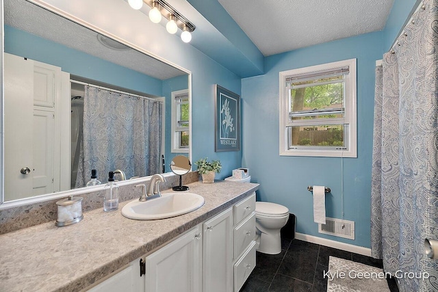 69 Cheyenne Ave, Holland, MI 49424 - bathroom featuring vanity, tile patterned floors, a textured ceiling, and curtained shower