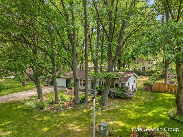 69 Cheyenne Ave, Holland, MI 49424 - view of front facade featuring concrete driveway and a garage