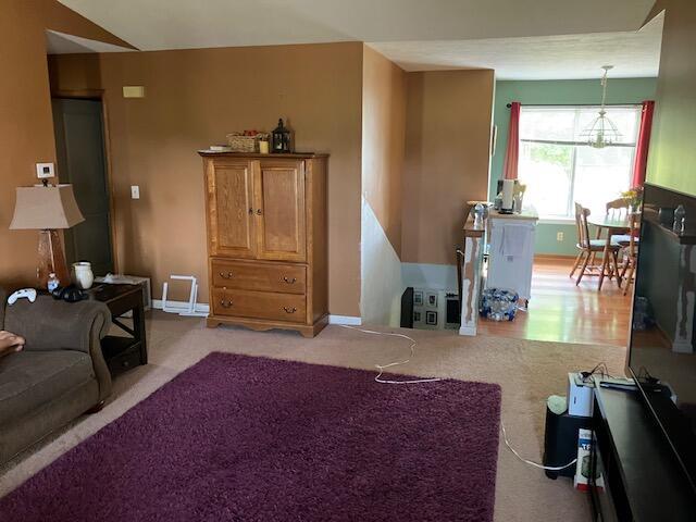 3052 143rd Ave, Dorr, MI 49323 - living area with baseboards and light carpet