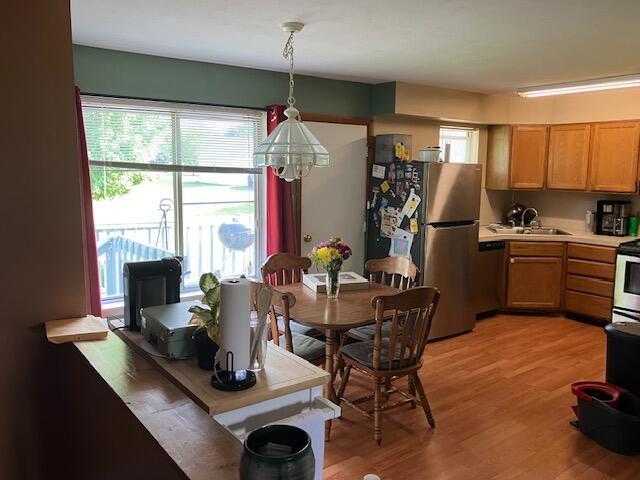 3052 143rd Ave, Dorr, MI 49323 - dining space featuring healthy amount of natural light and light wood-type flooring