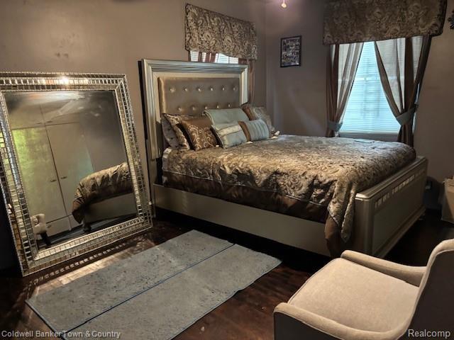 938 Barney Ave, Flint, MI 48503 - bedroom with wood finished floors