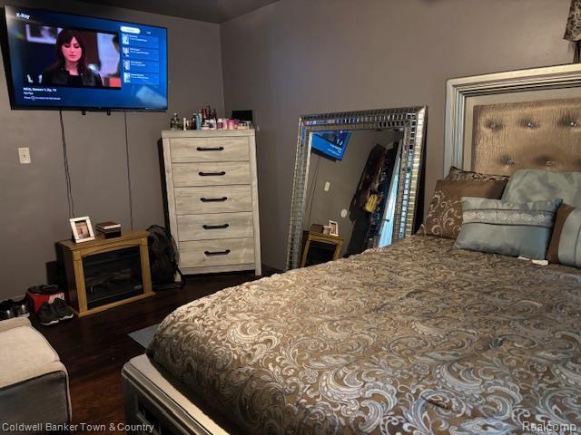 938 Barney Ave, Flint, MI 48503 - bedroom with dark wood-style flooring