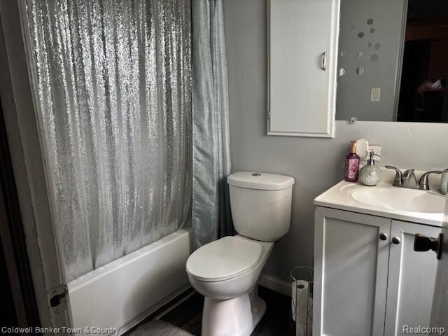 938 Barney Ave, Flint, MI 48503 - bathroom with vanity and shower / bathtub combination with curtain