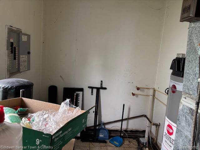 938 Barney Ave, Flint, MI 48503 - miscellaneous room featuring electric panel and water heater