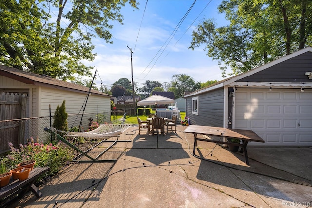 27728 Larchmont St, Saint Clair Shores, MI 48081 - view of patio / terrace with outdoor dining space, an outbuilding, and a garage