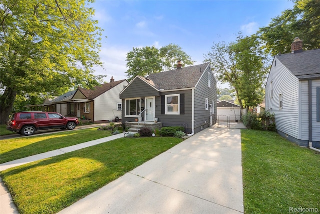 27728 Larchmont St, Saint Clair Shores, MI 48081 - bungalow-style home with an outdoor structure, a front yard, a detached garage, a shingled roof, and a chimney