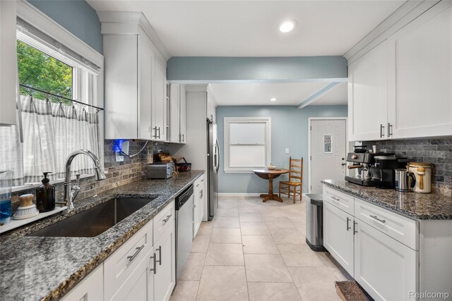 27728 Larchmont St, Saint Clair Shores, MI 48081 - kitchen with stainless steel appliances, decorative backsplash, white cabinetry, and recessed lighting