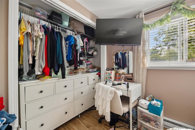 27728 Larchmont St, Saint Clair Shores, MI 48081 - spacious closet featuring a baseboard radiator and wood finished floors