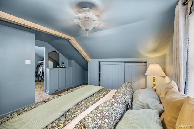 27728 Larchmont St, Saint Clair Shores, MI 48081 - bedroom with vaulted ceiling, a walk in closet, wood finished floors, ceiling fan, and a closet