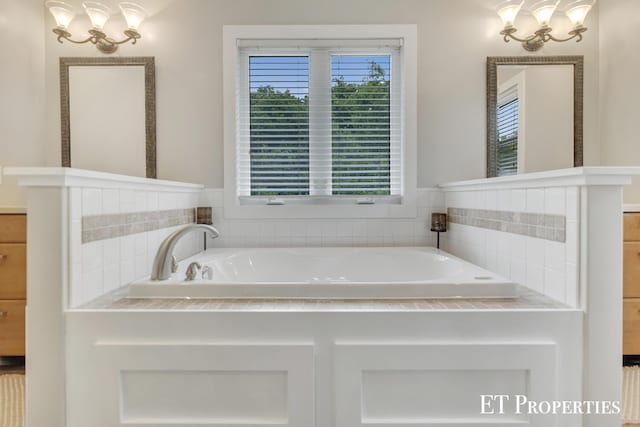 12150 W Devis Rd, West Olive, MI 49460 - full bath featuring a garden tub and a chandelier