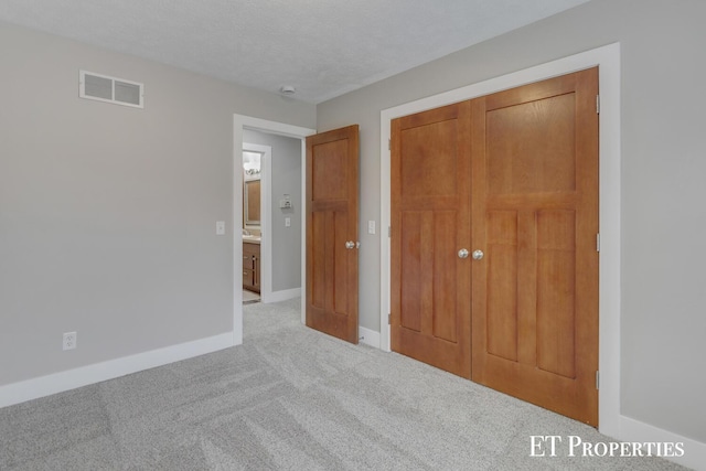 12150 W Devis Rd, West Olive, MI 49460 - unfurnished bedroom featuring carpet floors and a closet