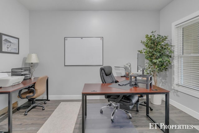 12150 W Devis Rd, West Olive, MI 49460 - home office featuring wood finished floors and baseboards