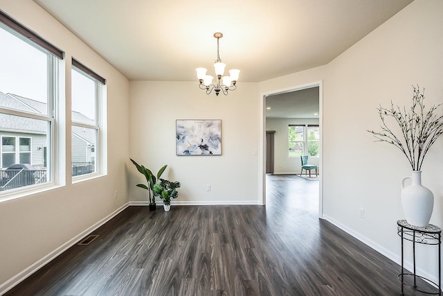 2767 St Regis Way, Ann Arbor, MI 48105 - spare room with dark wood-style floors and a chandelier