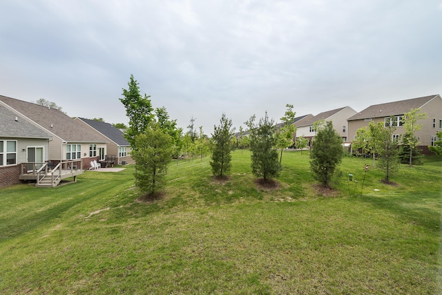 2767 St Regis Way, Ann Arbor, MI 48105 - view of green lawn featuring a residential view and a deck