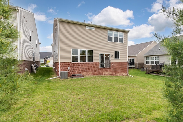 2767 St Regis Way, Ann Arbor, MI 48105 - rear view of property with brick siding and a yard