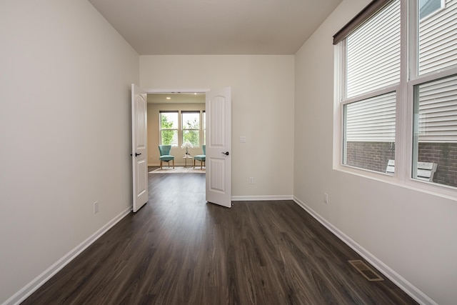2767 St Regis Way, Ann Arbor, MI 48105 - empty room featuring dark wood-style floors and baseboards