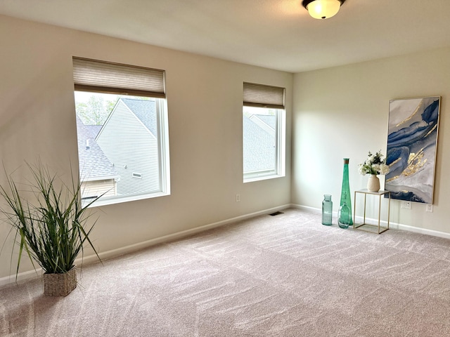 2767 St Regis Way, Ann Arbor, MI 48105 - empty room with carpet flooring and plenty of natural light