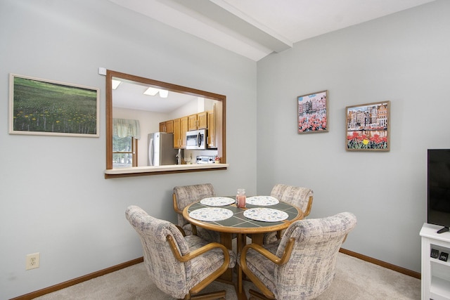 5973 Woodsong Way, Kalamazoo, MI 49009 - dining area with light carpet and vaulted ceiling