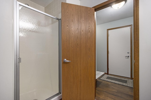 5973 Woodsong Way, Kalamazoo, MI 49009 - full bathroom featuring a shower stall and wood finished floors