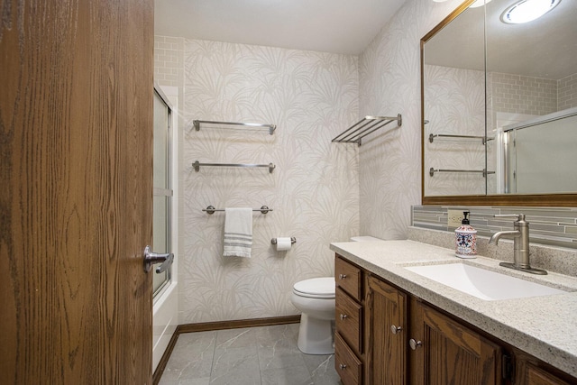 5973 Woodsong Way, Kalamazoo, MI 49009 - bathroom with wallpapered walls, vanity, and enclosed tub / shower combo