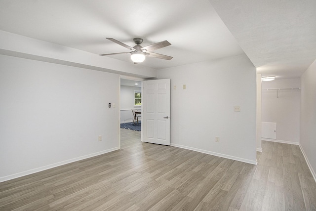 5973 Woodsong Way, Kalamazoo, MI 49009 - empty room with ceiling fan and light wood-style floors