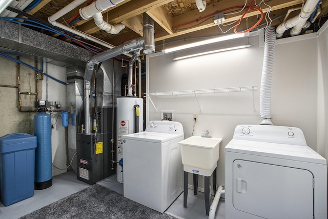5973 Woodsong Way, Kalamazoo, MI 49009 - washroom featuring washer and clothes dryer, water heater, and heating unit