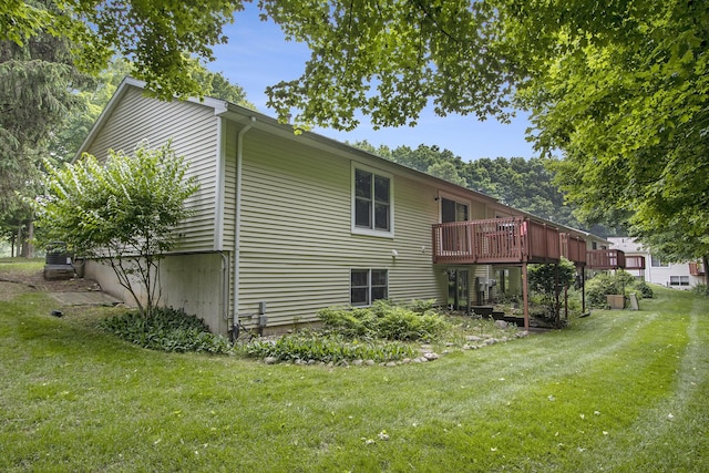 5973 Woodsong Way, Kalamazoo, MI 49009 - rear view of property featuring a yard and a wooden deck
