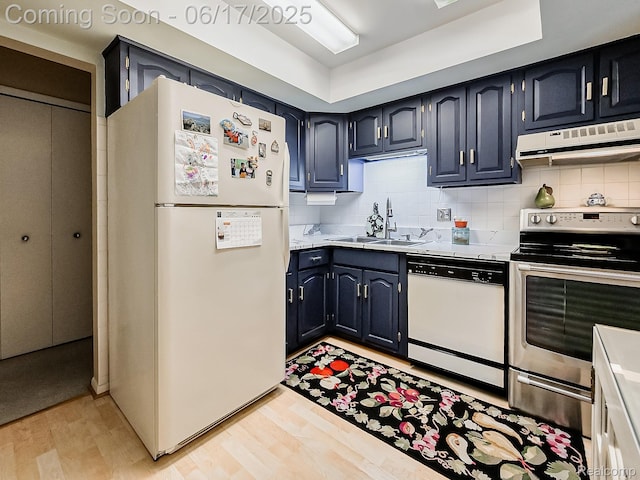 16820 Edloytom Way Unit 172, Clinton Township, MI 48038 - kitchen with white appliances, extractor fan, light wood-type flooring, tasteful backsplash, and light countertops
