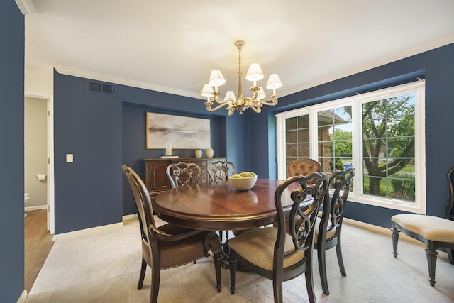 712 Dornoch Dr, Ann Arbor, MI 48103 - dining area with a chandelier and crown molding