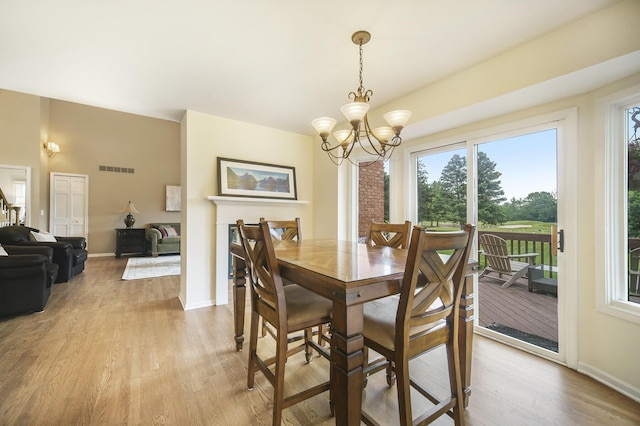 712 Dornoch Dr, Ann Arbor, MI 48103 - dining space featuring a chandelier and light wood finished floors