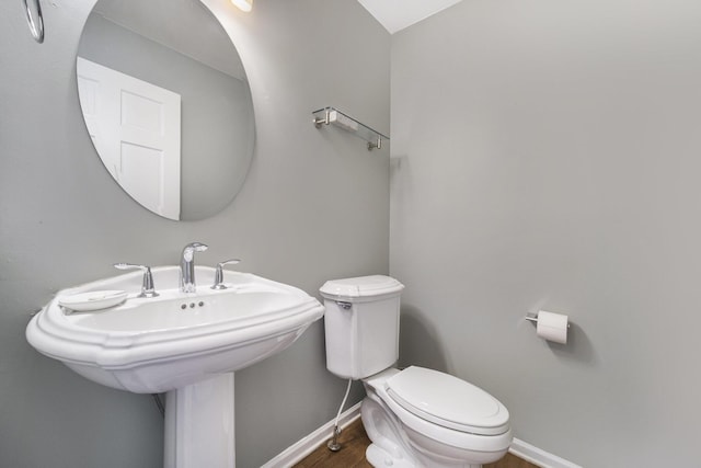 712 Dornoch Dr, Ann Arbor, MI 48103 - bathroom with baseboards and wood finished floors